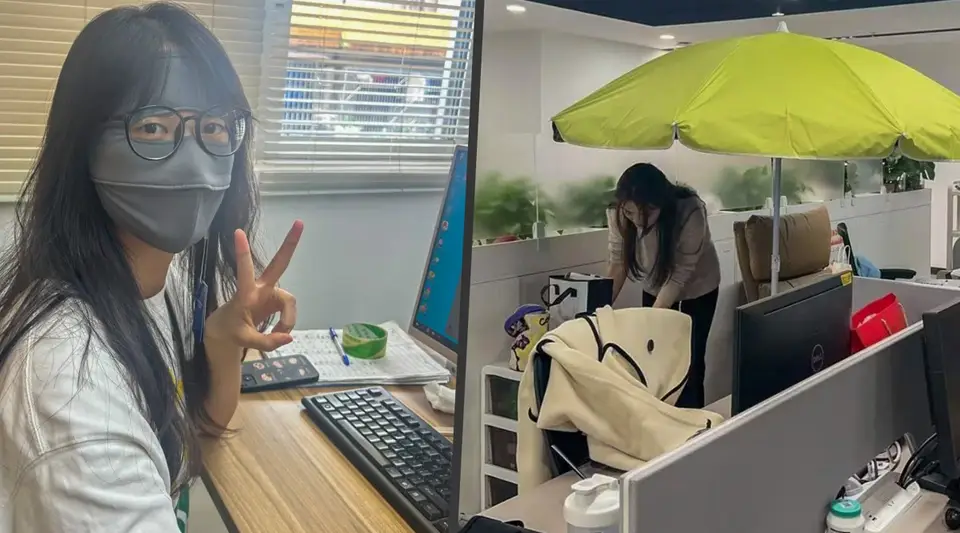 Ofiste şemsiye açıp maske takan Çinli çalışanlar artıyor