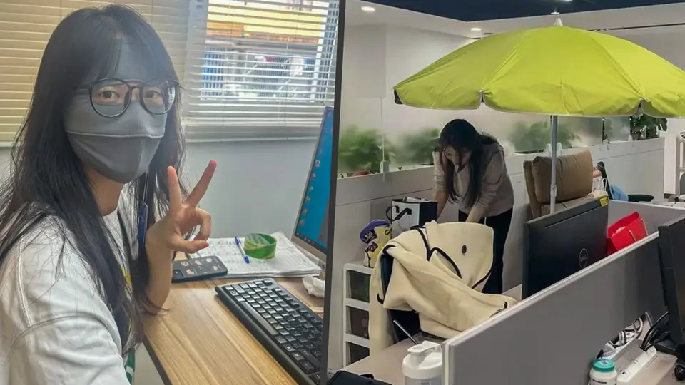 Ofiste şemsiye açıp maske takan Çinli çalışanlar artıyor